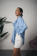 CAMICIA CON FIOCCO AZZURRA