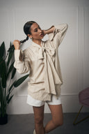 CAMICIA BEIGE FIOCCO