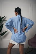 CAMICIA CON FIOCCO AZZURRA